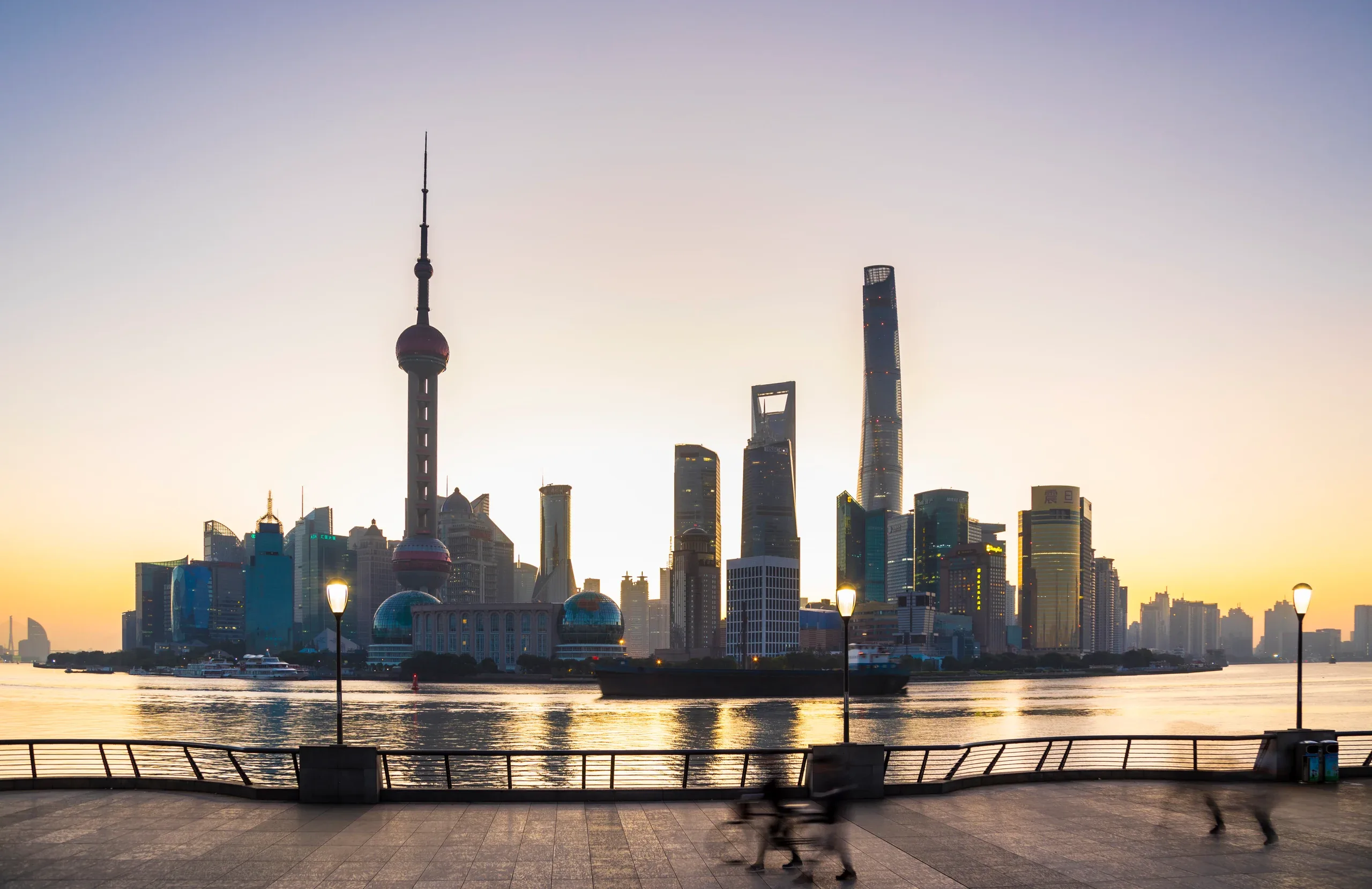 Shanghai’s Pudong skyline from the Huangpu riverfront at sunset